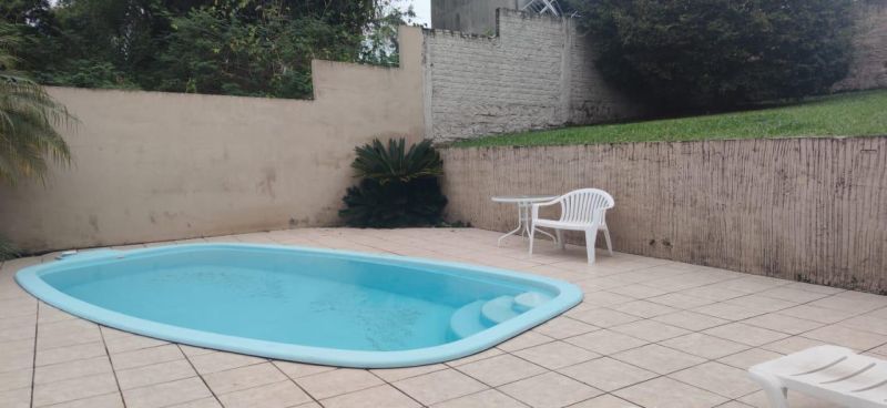 Casa com 3 quartos, 3 banheiros e 310m² à venda no bairro Sagrada Familia, Taquara