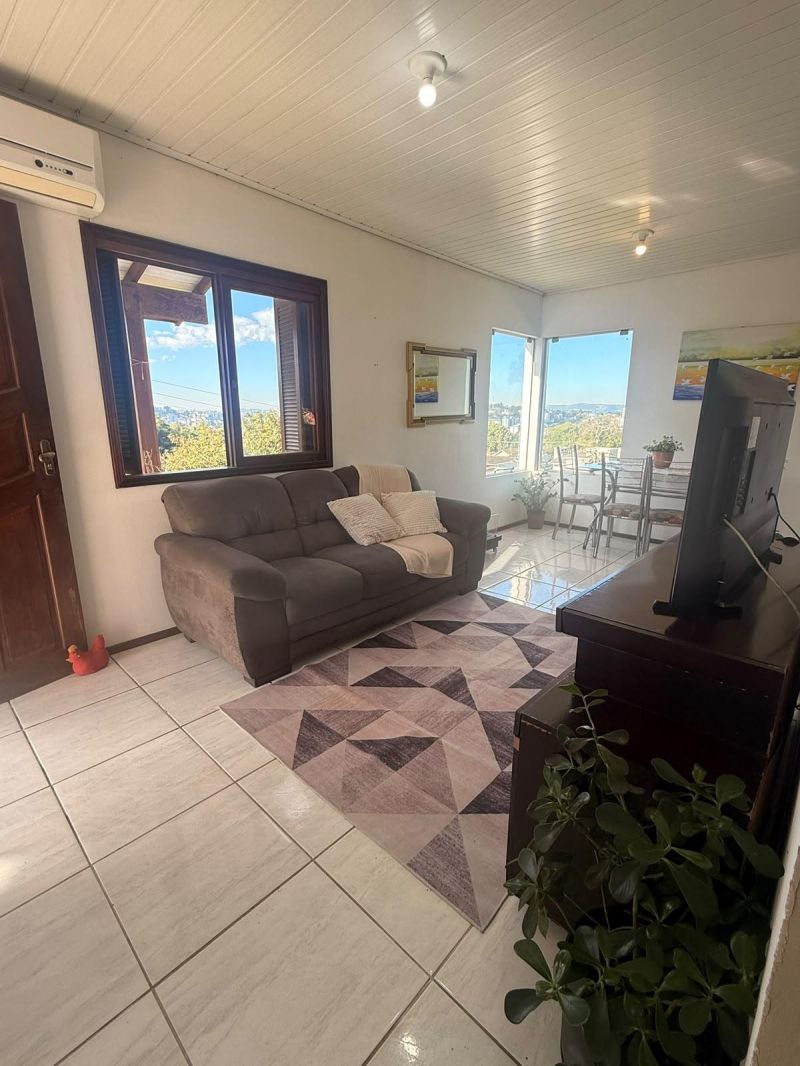 Taquara: Casa com Vista Deslumbrante em Área Residencial Alta