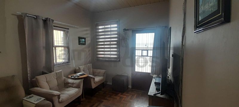 RESIDÊNCIA COM 2 DORMITÓRIOS, TÉRREA, COMPACTA, EM LOCALIZAÇÃO PRIVILEGIADA DO PARQUE MINUANO
