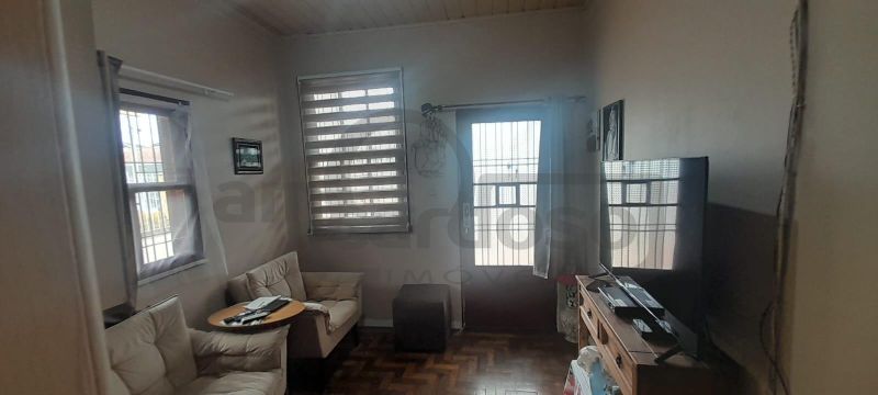 RESIDÊNCIA COM 2 DORMITÓRIOS, TÉRREA, COMPACTA, EM LOCALIZAÇÃO PRIVILEGIADA DO PARQUE MINUANO