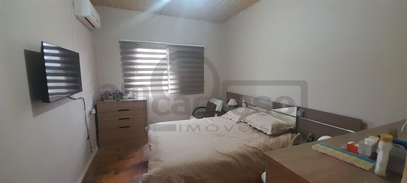 RESIDÊNCIA COM 2 DORMITÓRIOS, TÉRREA, COMPACTA, EM LOCALIZAÇÃO PRIVILEGIADA DO PARQUE MINUANO