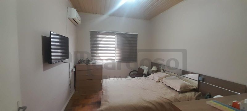 RESIDÊNCIA COM 2 DORMITÓRIOS, TÉRREA, COMPACTA, EM LOCALIZAÇÃO PRIVILEGIADA DO PARQUE MINUANO