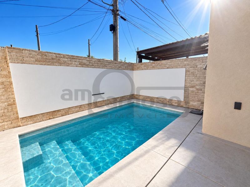 CASA TÉRREA DE ESQUINA, COM PISCINA E EXCELENTE POSIÇÃO SOLAR NO VILLAGE BLU – CACHOEIRINHA